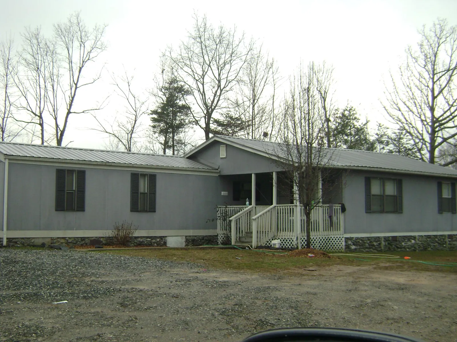 Metal roof over a manufactured home with a covered front porch in Hopatcong